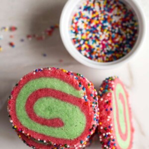 Christmas Swirl Sprinkle Cookies | A gluten free Christmas cookie recipe for red and green swirled sugar cookies covered in sprinkles!