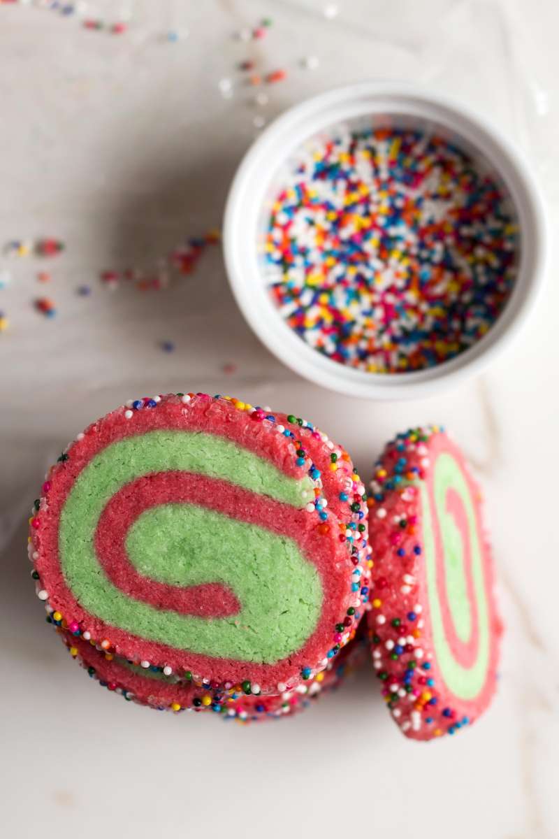 Christmas Swirl Sprinkle Cookies | A gluten free Christmas cookie recipe for red and green swirled sugar cookies covered in sprinkles!