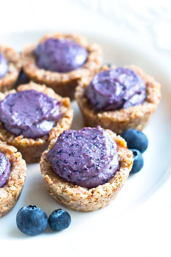 Gluten-free Healthy Blueberry Tarts on a white plate for a healthy treat.