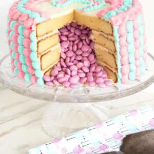 Gender Reveal Cake | An exciting gender reveal cake that is full of a surprise -- M&M's revealing the gender of the baby!