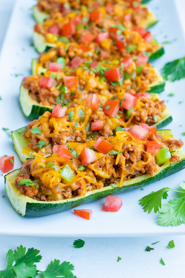 Oven-baked and healthy zucchini boat recipe with a Mexican taco filling.