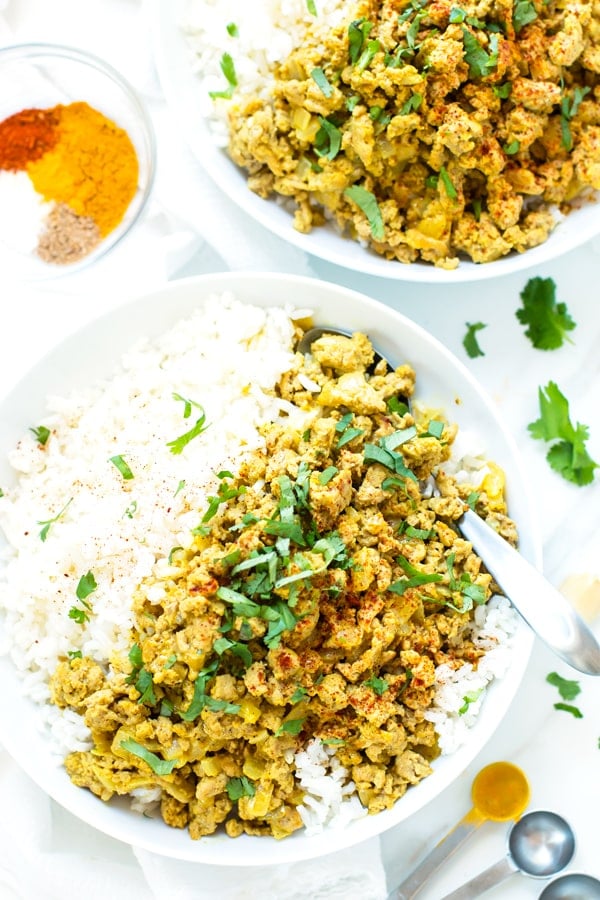 Two white bowls filled with a healthy curry recipe for an easy dinner.
