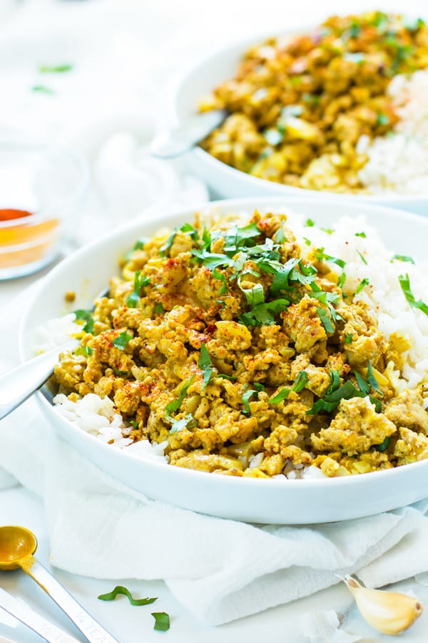 Two plates filled with Easy Ground Turkey Curry and rice for a delicious dinner.