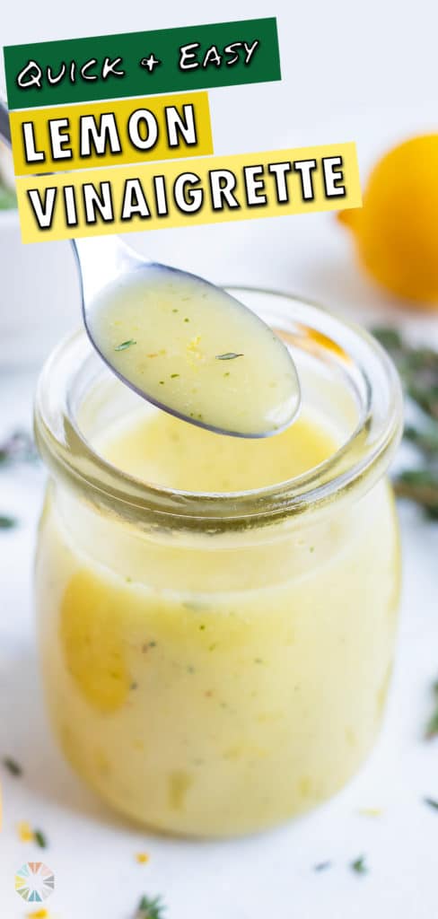 A spoon is used to lift the lemon vinaigrette from the jar.