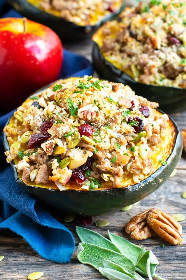 Stuffed acorn squash is an elegant and easy gluten-free recipe that is full of cranberries, pecans, apples and ground turkey.  This healthy stuffed acorn squash recipe is perfect for Fall & Winter dinners or get-togethers!