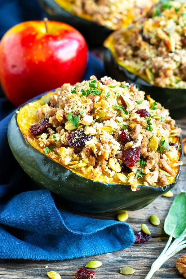 Stuffed acorn squash is an elegant and easy gluten-free recipe that is full of cranberries, pecans, apples and ground turkey.  This healthy stuffed acorn squash recipe is perfect for Fall & Winter dinners or get-togethers!