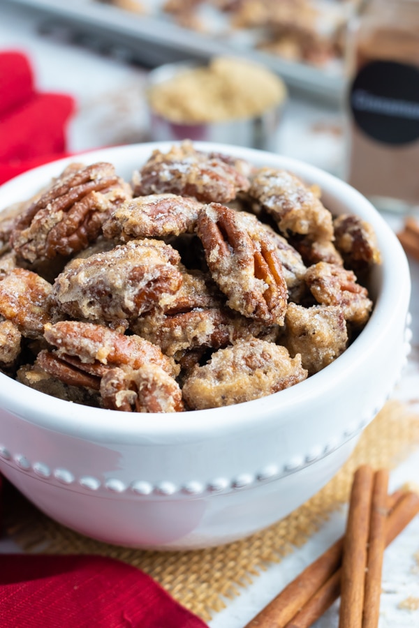 A bowl full of easy candied pecans with cinnamon sugar for holiday snacking.