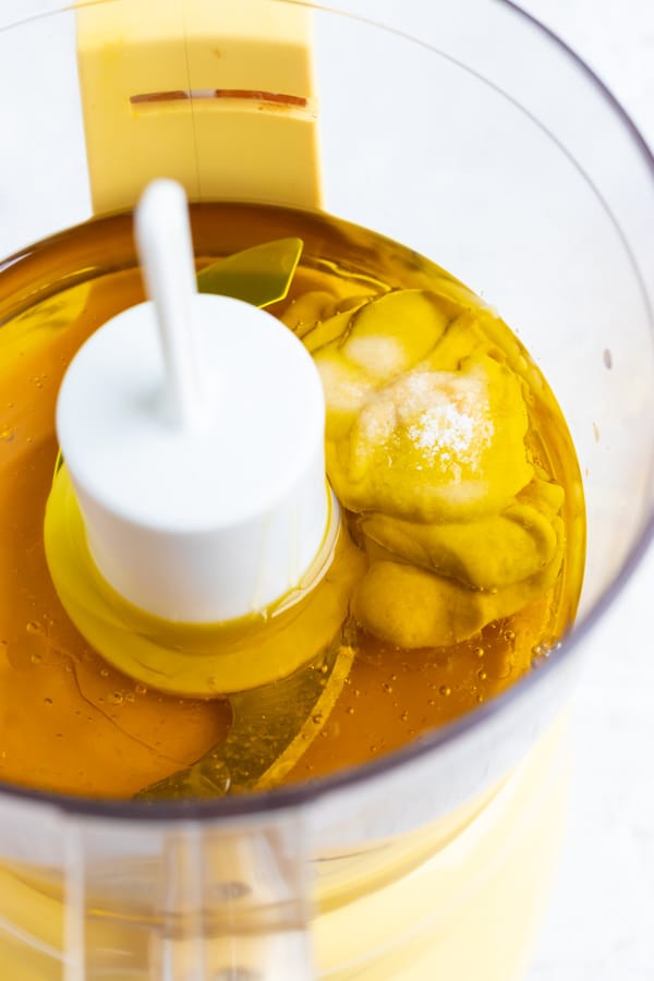 Honey mustard vinaigrette ingredients in a food processor.