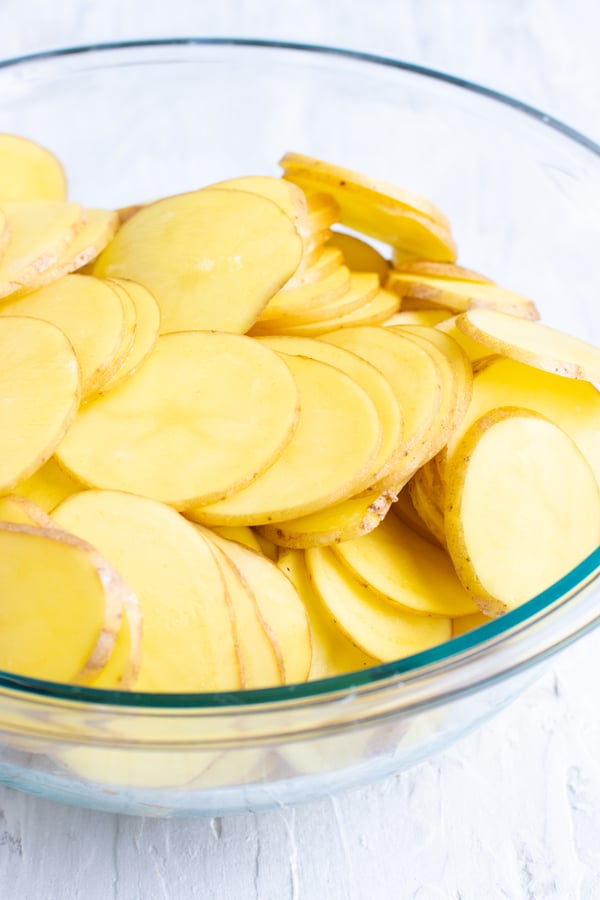 Thinly sliced Yukon gold potatoes as the best type of potato for a scalloped potatoes recipe.
