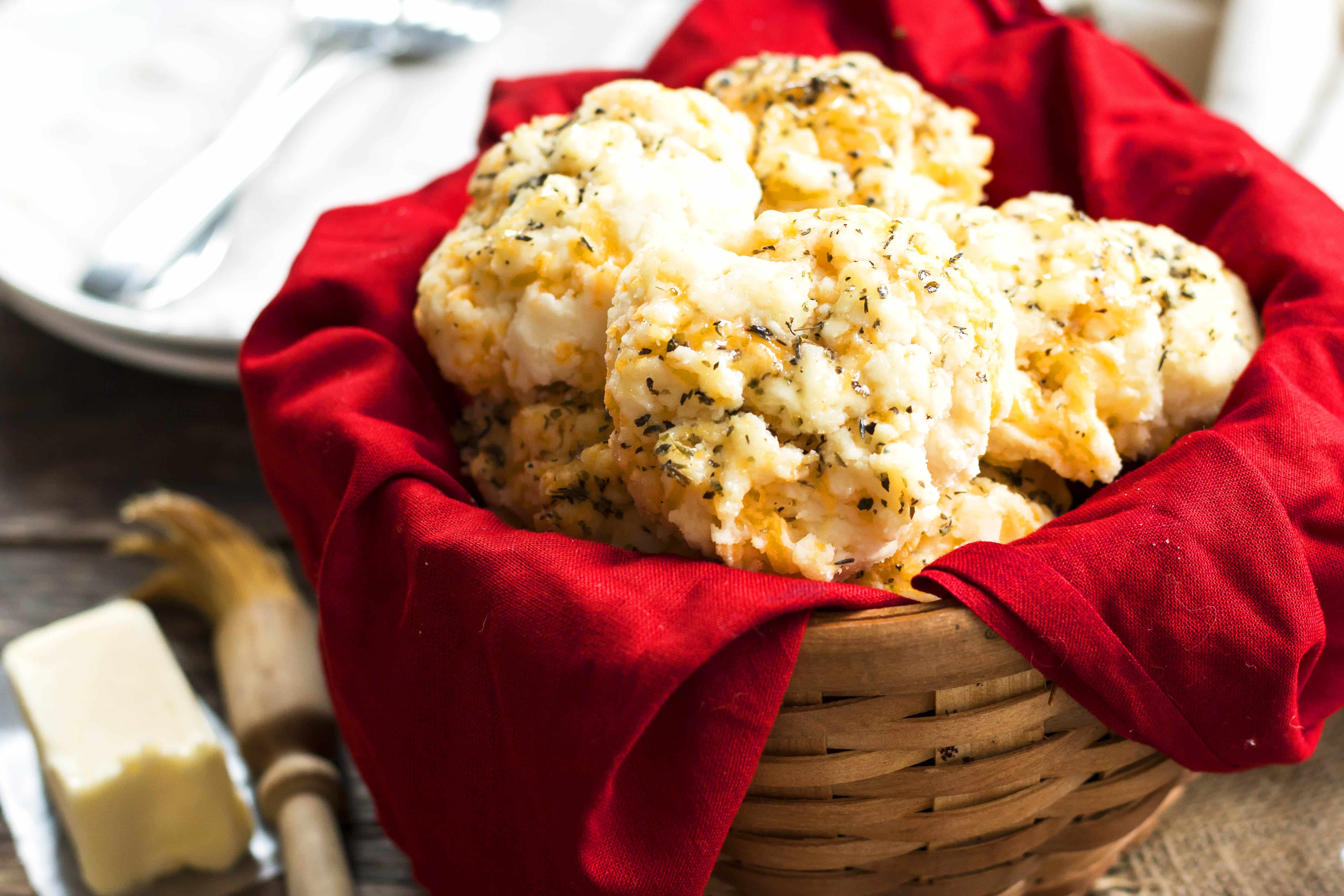 A basket filled collection of biscuits using a Bisquick biscuit recipe similar to Red Lobster's for a delicious dinner.