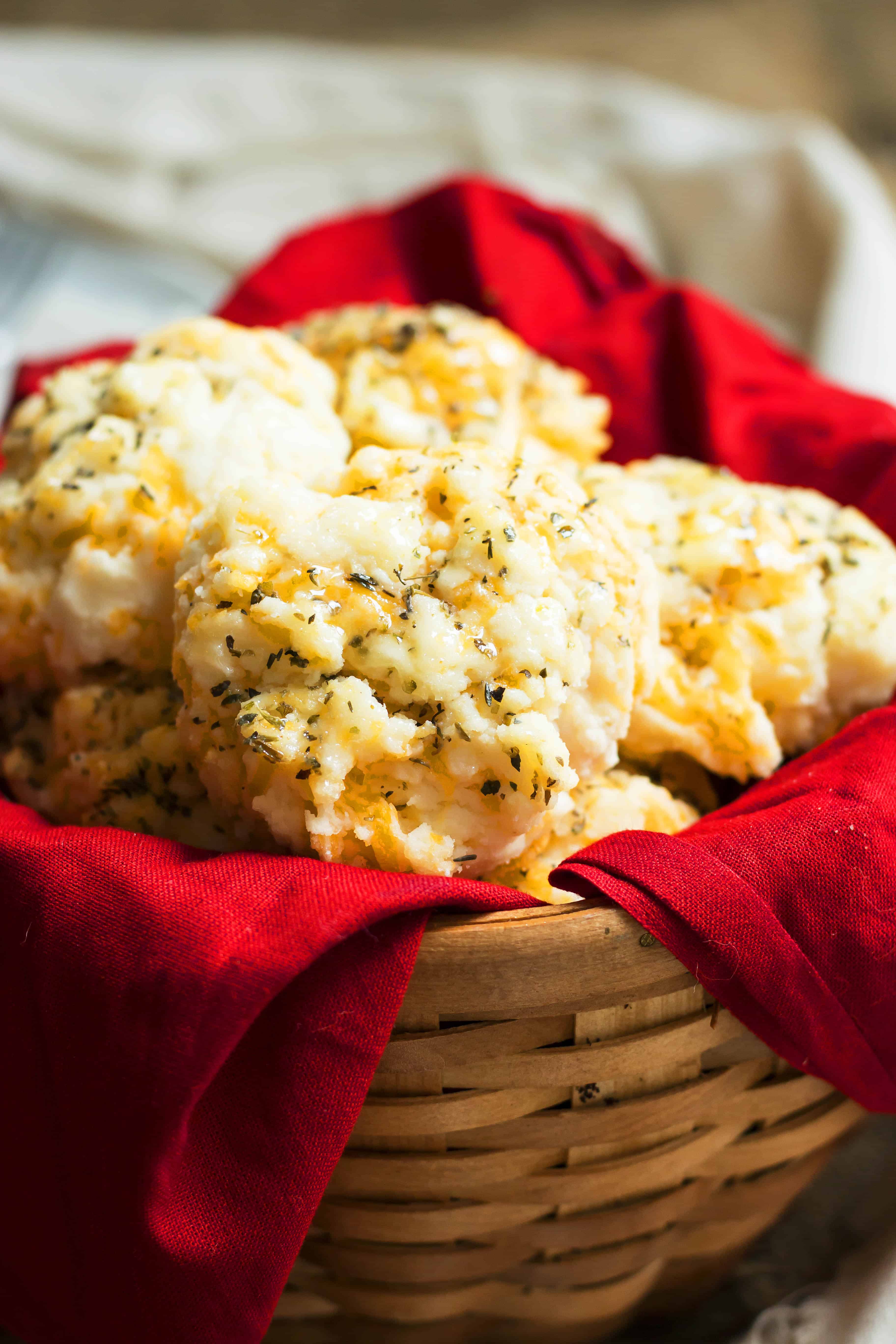 A basket lined with a red napkin and filled with gluten-free Copycat Red Lobster biscuits.