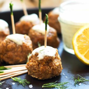 Gluten-free Mediterranean Turkey Meatballs with a toothpick placed in the middle for a delicious snack.