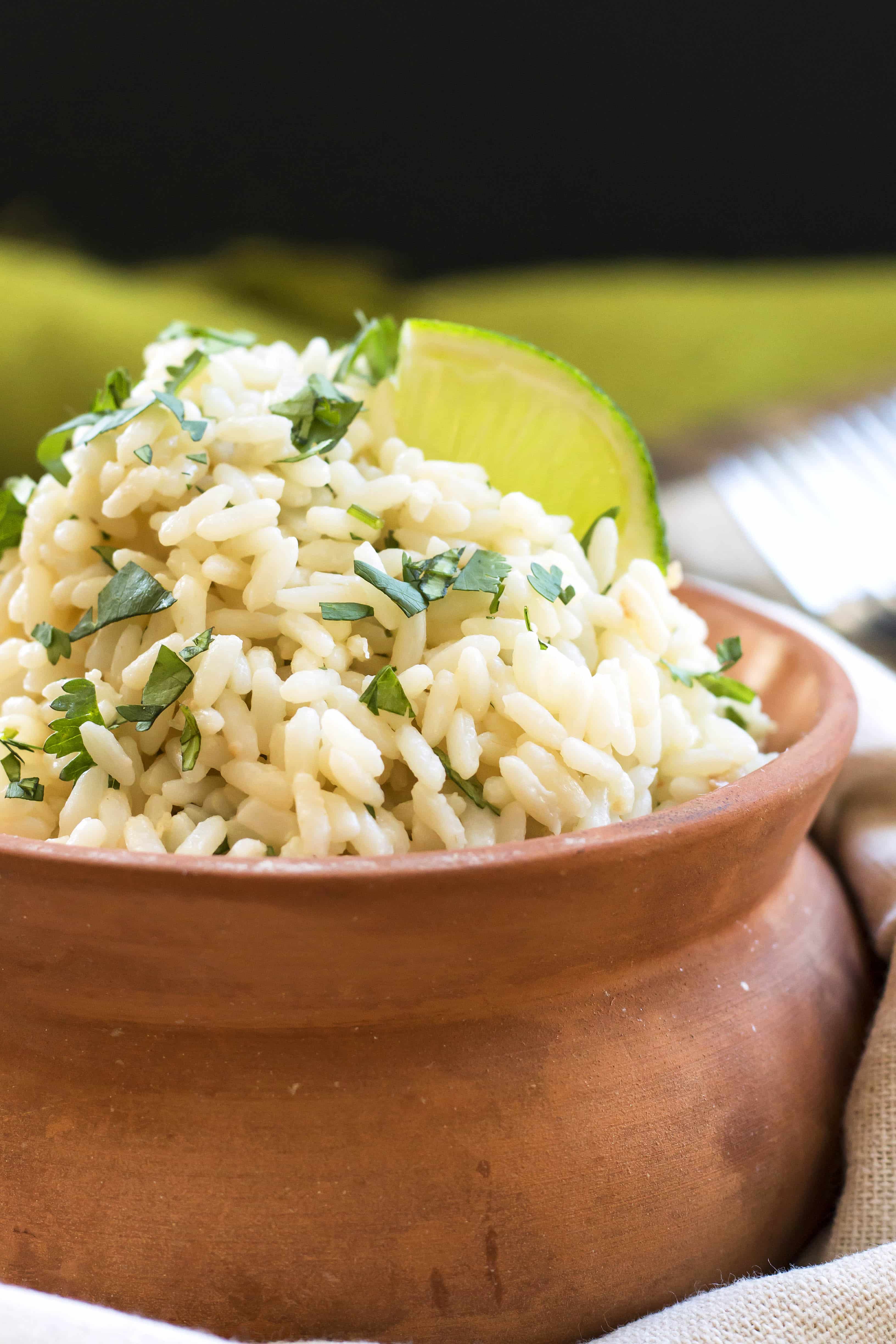 A bowl with a healthy brown rice recipe with coconut and cilantro.