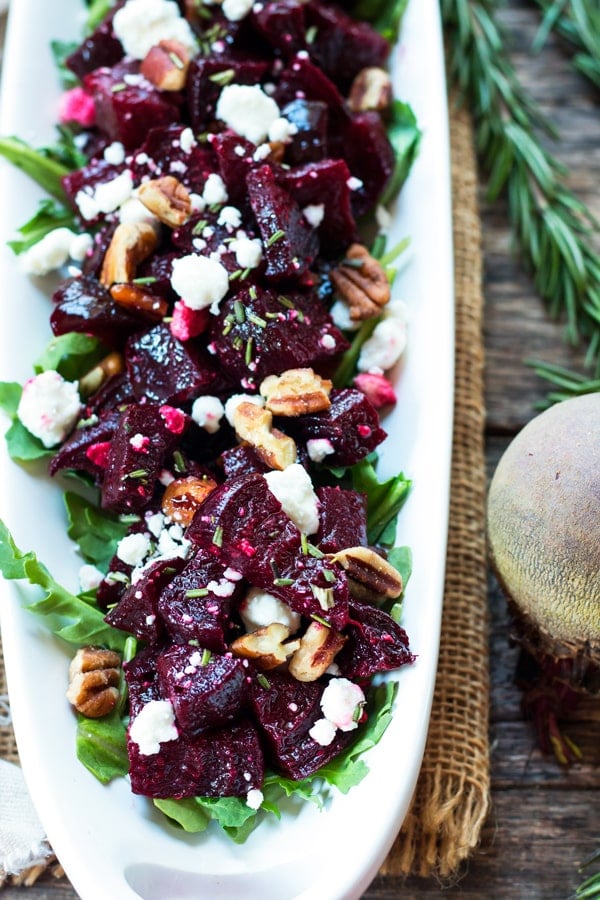 A tray filled with roasted beets, goat cheese, and pecans for an easy holiday side dish.
