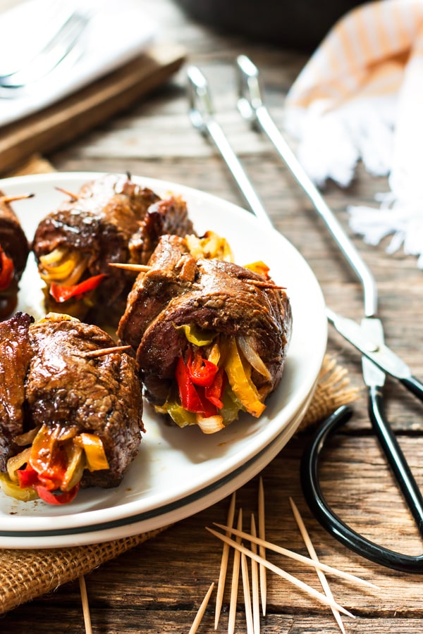 Balsamic Glazed Flank Steak & Veggie Roll-Ups | A healthy, gluten free dinner recipe for flank steak that is filled with roasted bell peppers and onions.