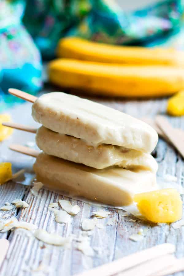 Non-Alcoholic Pina Colada Pops | This popsicle recipe is wonderful for when you are craving a tropical drink without the alcohol. Pineapples, bananas, and coconut milk give this summer treat its great flavor!
