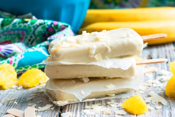 Non-Alcoholic Pina Colada Pops | This popsicle recipe is wonderful for when you are craving a tropical drink without the alcohol. Pineapples, bananas, and coconut milk give this summer treat its great flavor!