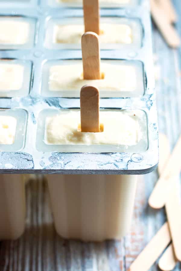 Non-Alcoholic Pina Colada Pops | This popsicle recipe is wonderful for when you are craving a tropical drink without the alcohol. Pineapples, bananas, and coconut milk give this summer treat its great flavor!