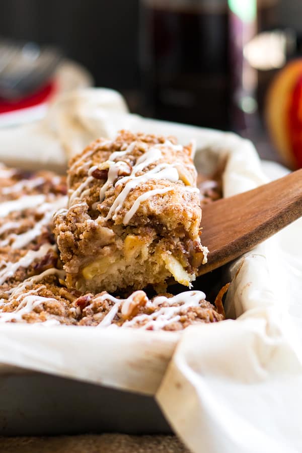 Gluten Free Apple Coffee Cake with Pecans | A gluten free coffee cake that is bursting with fresh apple flavor, cinnamon, and finished with a crumb topping and creamy glaze!