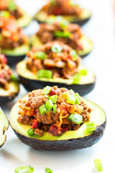 Beef Taco Stuffed Avocados | A healthy dinner recipe for avocados that are full of taco filling! It's gluten free, low-carb, and keto, too!