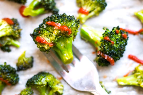 Gluten-free oven roasted broccoli with Sriracha and honey for an easy side dish.