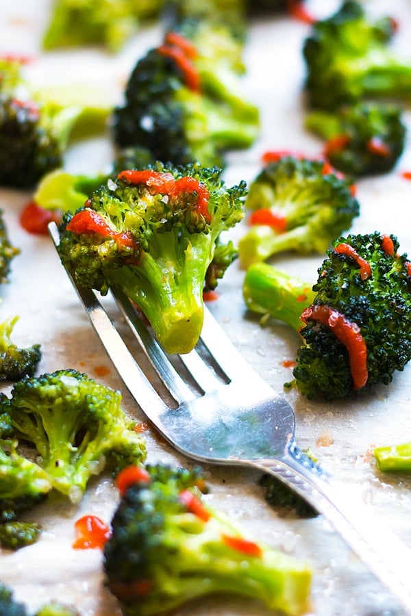 Roasted Broccoli with Sriracha and Honey on a fork for a healthy dinner.