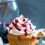 Peanut Butter Cupcakes with Jelly Filling | PBJ in cupcake form!! A yummy peanut butter cupcake is filled with grape jelly filling and topped with a creamy buttercream frosting.
