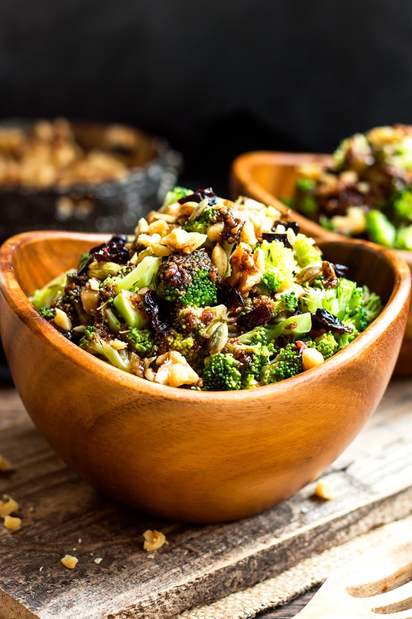 Chopped Broccoli Salad with Balsamic, Walnuts and Cranberries | A healthy, gluten free side dish for broccoli salad that is tossed in a savory-sweet balsamic vinaigrette glaze and topped with pumpkin seeds, cranberries and walnuts.