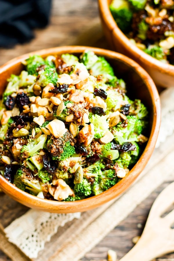 An overhead picture of a healthy broccoli salad made with walnuts and cranberries.