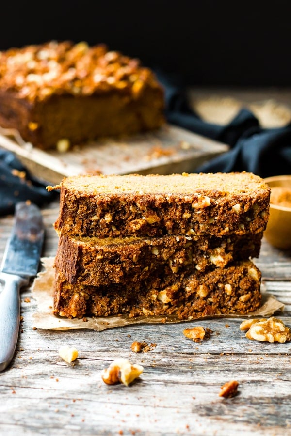 Three slices of Coconut Flour Pumpkin Bread on a table ready for the winter months.