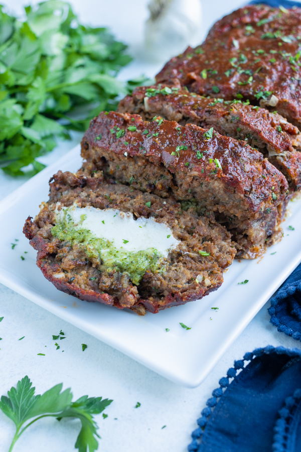 Sliced meatloaf is served for a hearty dinner dish.