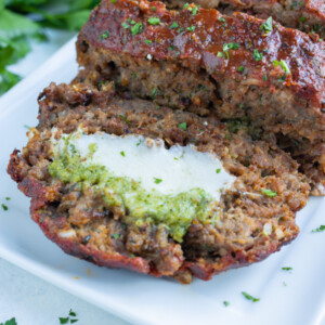 Meatloaf is stuffed with cheese and pesto.