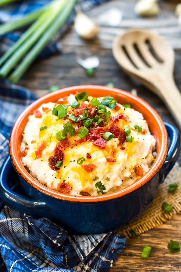 Gluten-free Loaded Cauliflower Mashed Potatoes in a blue bowl for a healthy side dish.