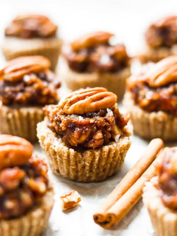 Pecan Pie Mini Tarts on parchment paper ready for the holidays.