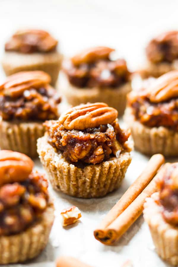 Pecan Pie Mini Tarts on parchment paper ready for the holidays.