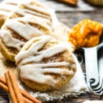 Snickerdoodle Pumpkin Cookies | A super soft, gluten free pumpkin spice cookie that is rolled in cinnamon sugar and topped with a sweet glaze!