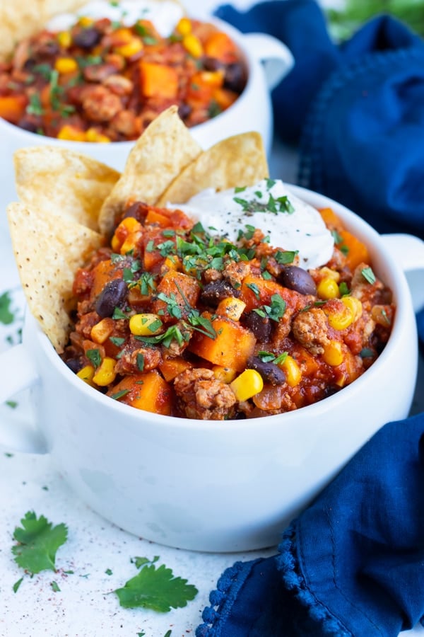 A bowl of Sweet Potato Chili is loaded with ground turkey, sweet potato, and seasonings for a fall meal!