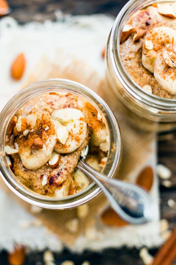 An overhead picture of oatmeal in a jar with a spoon inside.