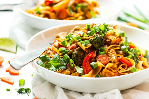 A white bowl containing gluten-free Pad See Ew for an easy lunch.