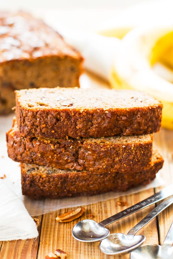 Slices of paleo banana bread on parchment paper ready to eat for dessert.