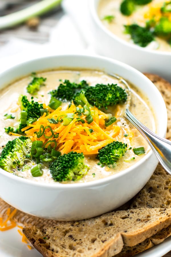 Gluten-free broccoli cheese soup in a bowl with a spoon.