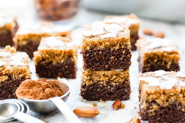 Gluten-free German Chocolate Bars on parchment paper for a delicious dessert.