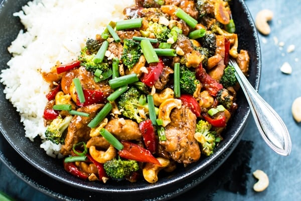 An overhead picture of chicken cashew stir-fry with rice for a healthy dinner.