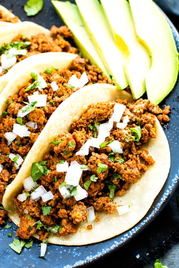 A ground turkey taco recipe on a plate with other tacos for an easy lunch.