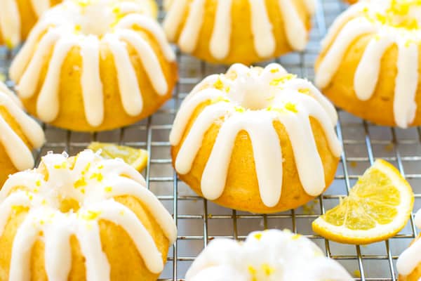 A cooling rack with Mini Lemon Bundt Cakes on the top for a spring dessert.