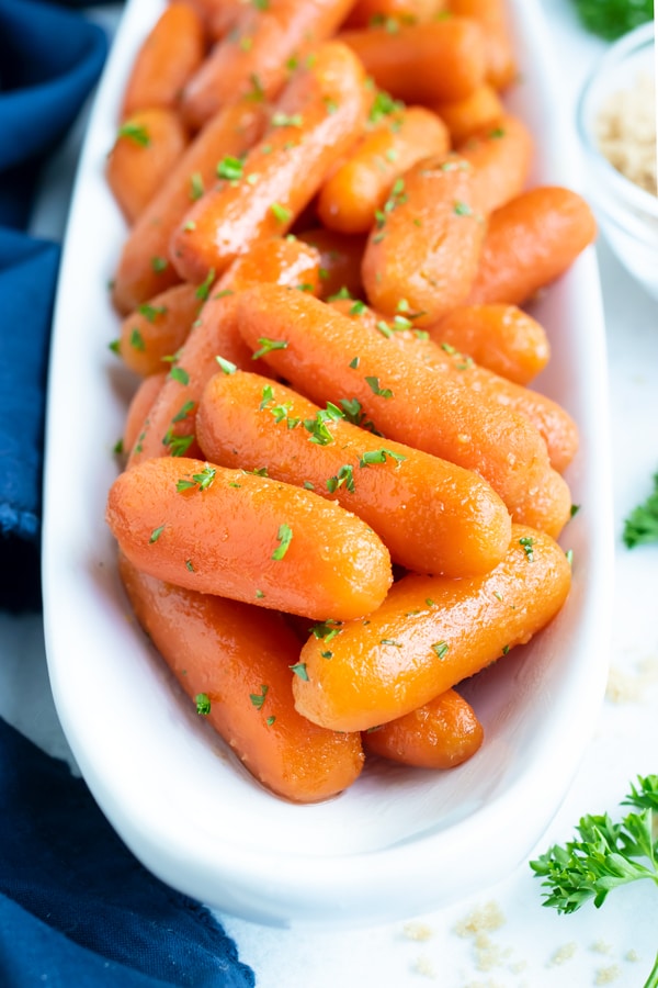 Easy Easter side dish for honey carrots with a brown sugar glaze that were made in a slow cooker.