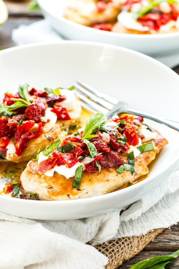 Gluten-free goat cheese stuffed chicken on a white plate for an easy meal.
