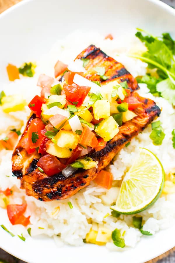 Gluten-free pineapple bbq chicken with lime slices on rice for an easy dinner.