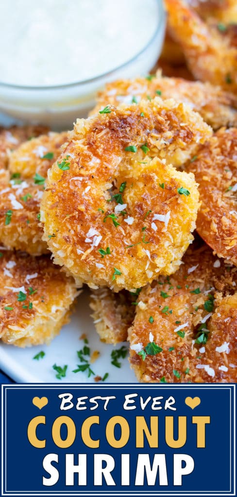 Red Lobster's coconut shrimp on a white plate with sprinkles of parsley and shredded coconut.