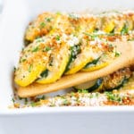 A squash casserole recipe with yellow squash and zucchini and a breadcrumb and Parmesan cheese topping.